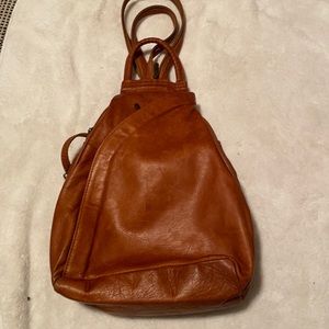 Brown leather cross over back pack